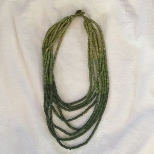 Green multi strand wooden bead necklace