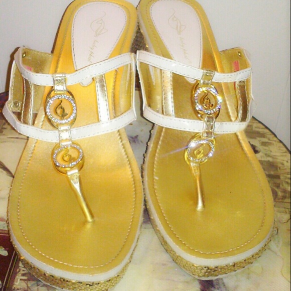 Gold and white sandals