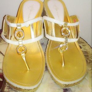 Gold and white sandals