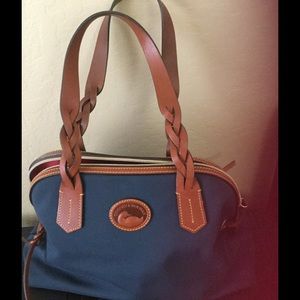 Navy canvas and leather zip top bag.