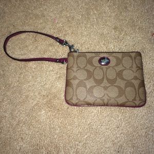 Coach Wristlet with Berry colored wrist strap!