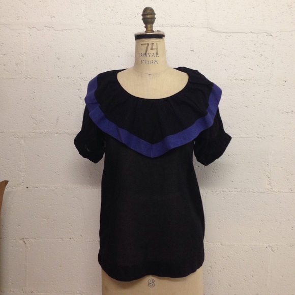 Black top with blue collar detail