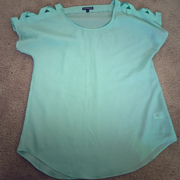 Sheer light blue top, with sleeve cris cross.