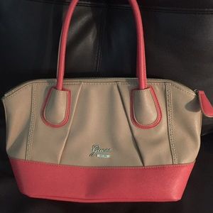 Coral and tan Guess purse