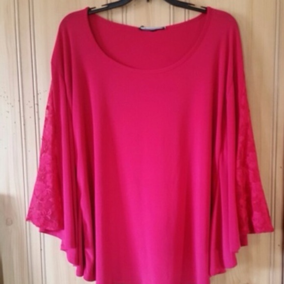 Pink batwing, laced sleeve blouse.