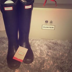 Matte black hunter boots.