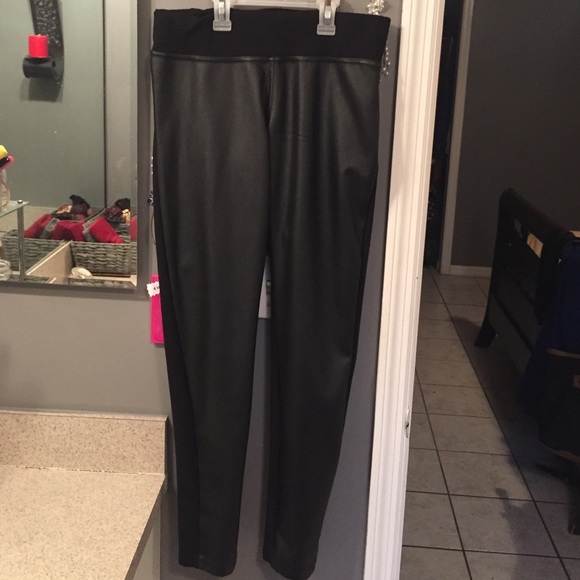 Black leather like material on front pants!