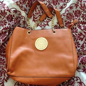 Brown bag with medallion