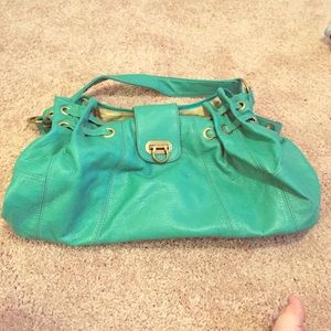 Medium-sized teal purse.