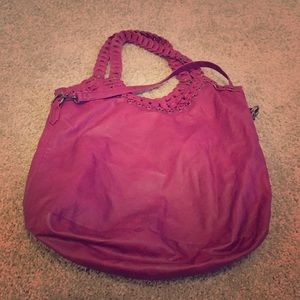 Large burgundy hobo bag.