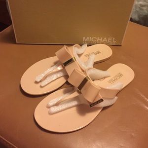 Never worn Michael Kors flip flops