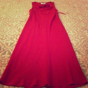 Long elegant red dress with sequins.