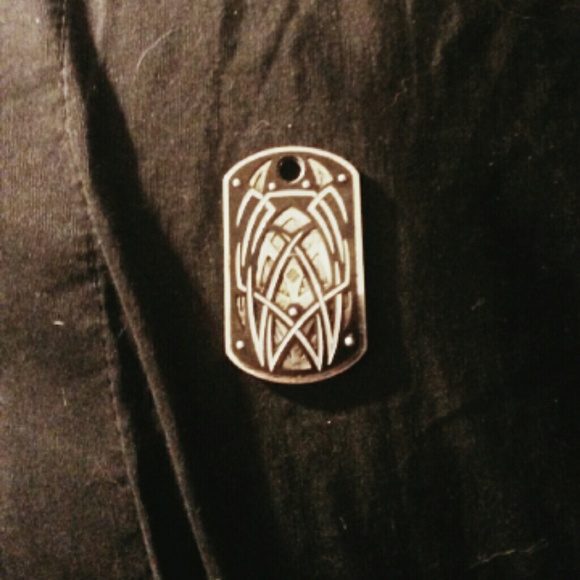 Silver and diamond dog tag necklace charm.