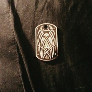 Silver and diamond dog tag necklace charm.