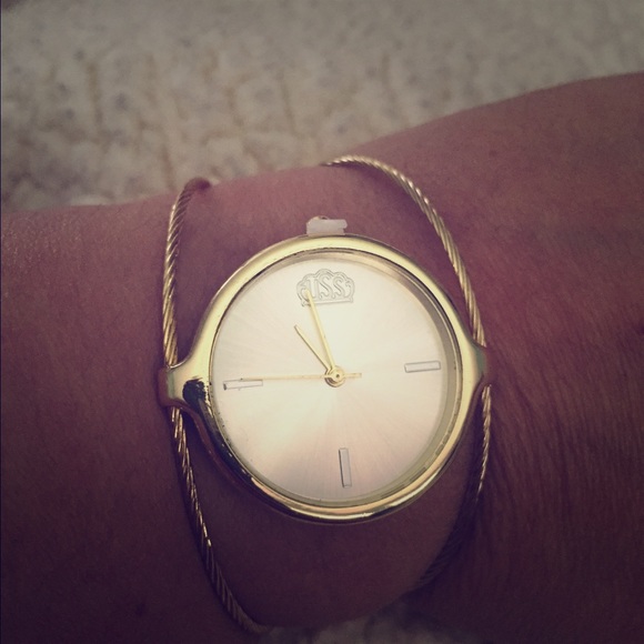 Wire bangle style watch in gold tone