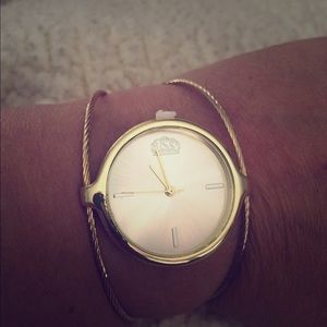 Wire bangle style watch in gold tone