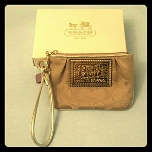 Beige Coach wristlet
