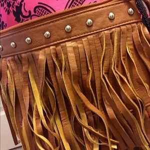 Bebe fringe cross body bag.