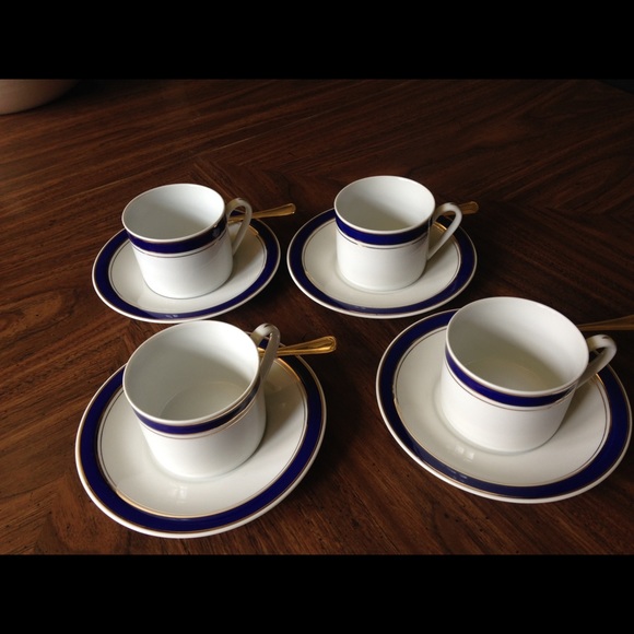 Four Cappuccino cups and saucers with gold spoons