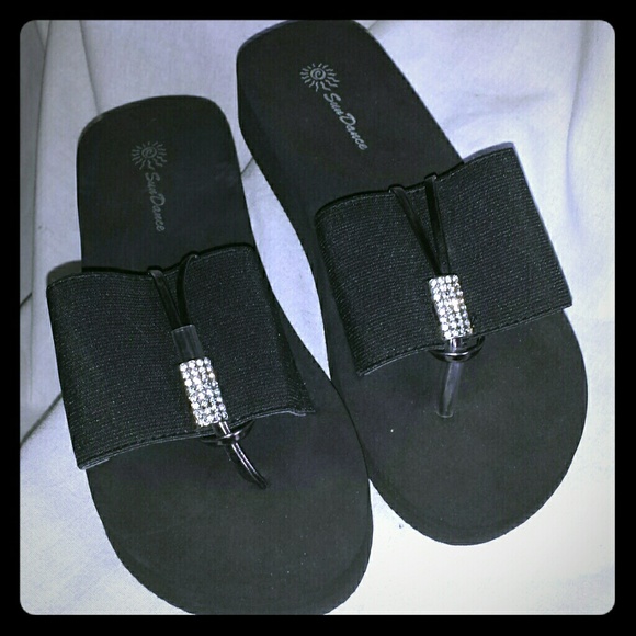 Black wedge ornate flip flops size 6. 5