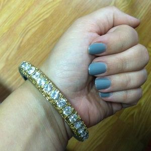 Gold bangle with silver rhinestones