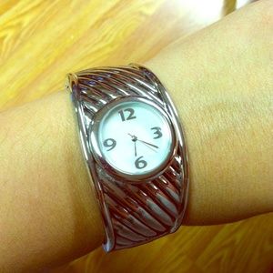 Silver cuff watch with white face