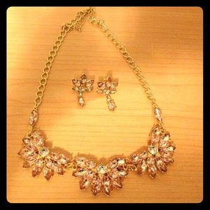 Gold and pink necklace with matching earrings.