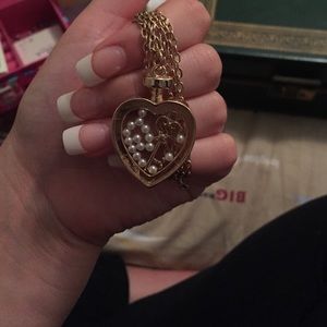Heart shaped necklace with key inside