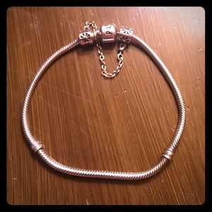 Pandora bracelet with safety chain.