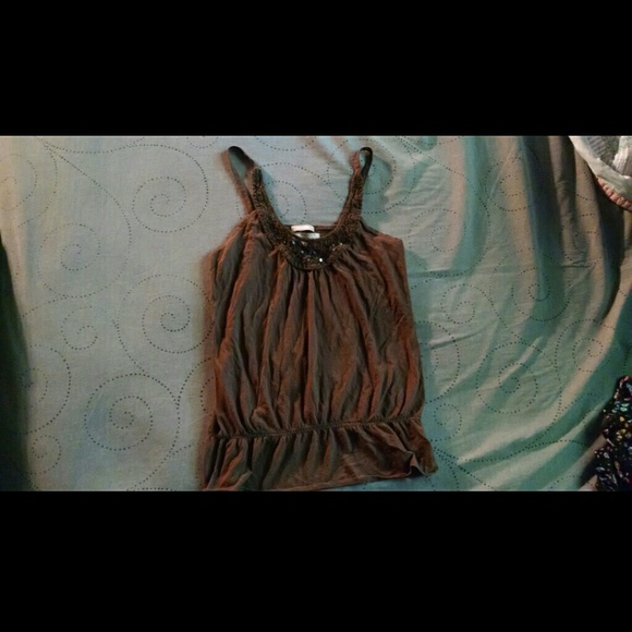 Flowy tank top with lace embellishments.