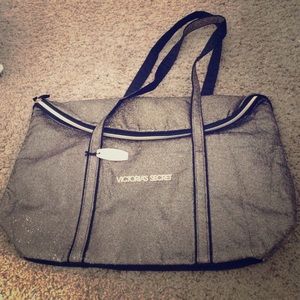 Black and gold sparkle Victoria's Secret bag.