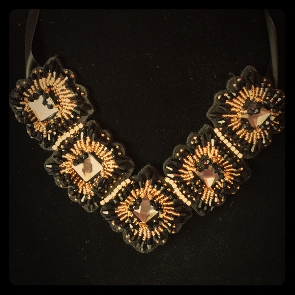 Beautiful gold and black tie necklace