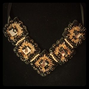 Beautiful gold and black tie necklace