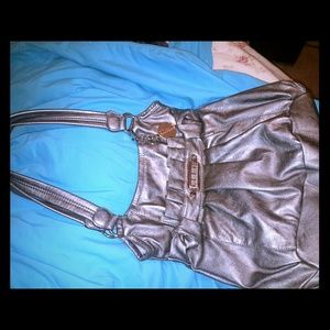 Beautiful like new gray ellie purse. Many pockets