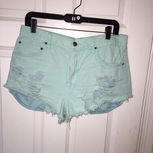 High wasted distressed teal shorts