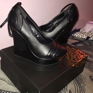 Black strap wedge shoes