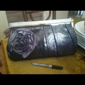 Purple clutch purse with flower
