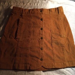 Corduroy skirt with snap buttons down the middle