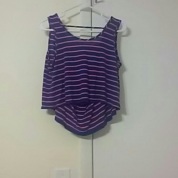 Cropped tank with dip in the back.