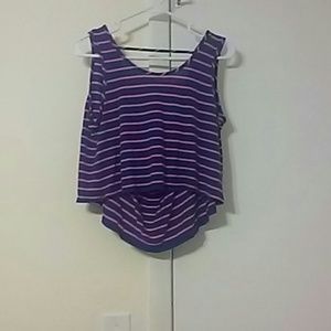 Cropped tank with dip in the back.