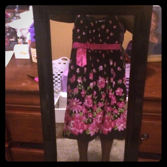 Black dress with pink flowers and green leaves