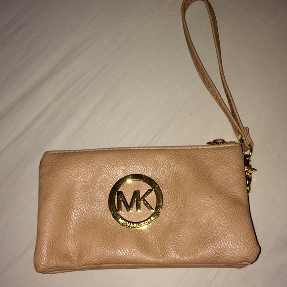 Nude wristlet with gold zipper