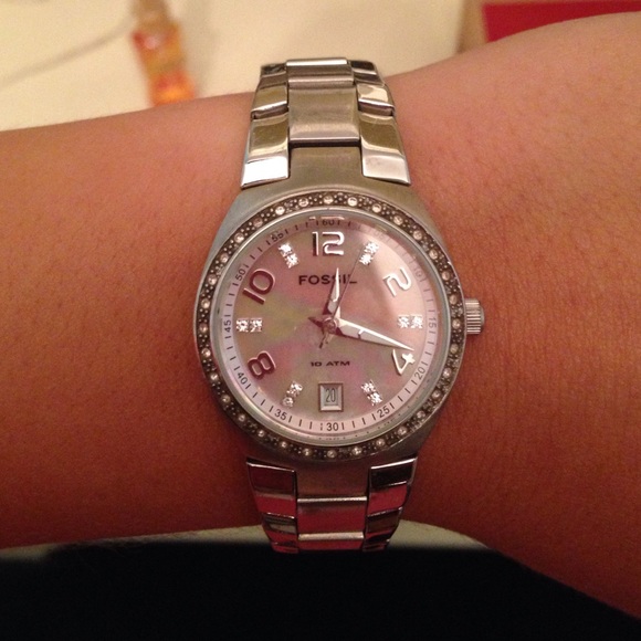 Silver fossil watch with light pink shimmery face