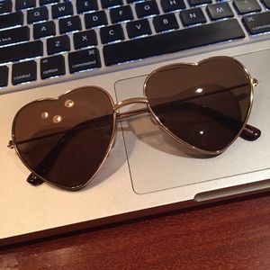 Heart shaped, gold rimmed sunglasses