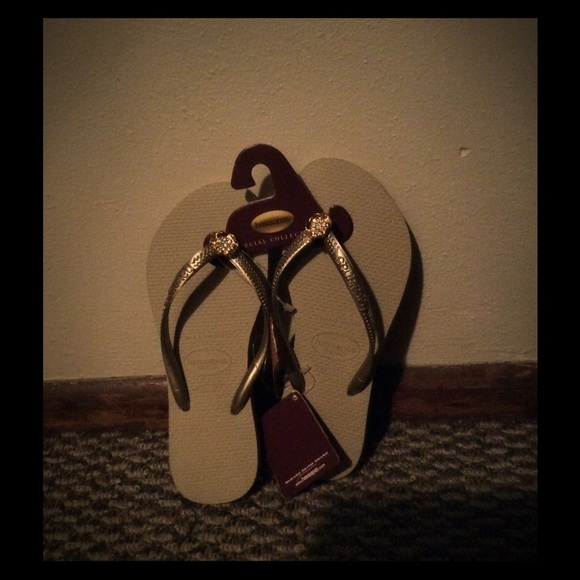 Tan and gold flip flop