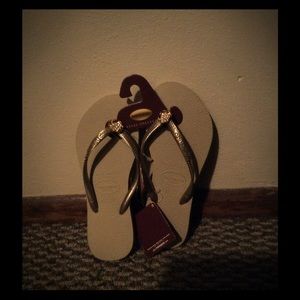 Tan and gold flip flop