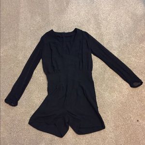 Black, sheer sleeve, low v-neck romper.