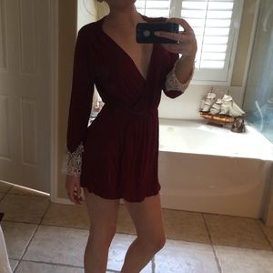 maroon dress, with white lace sleeves