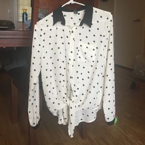 Black and white polka dot shirt.