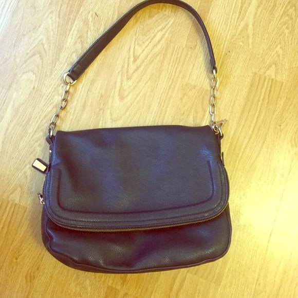 Black purse with gold zippers